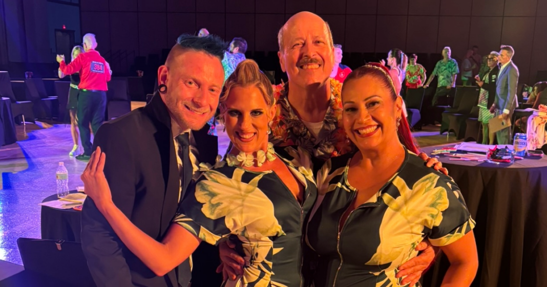 Amy Hanson smiling with fellow dancers and friends at the 2026 Heart of America DanceSport Championships in Kansas City