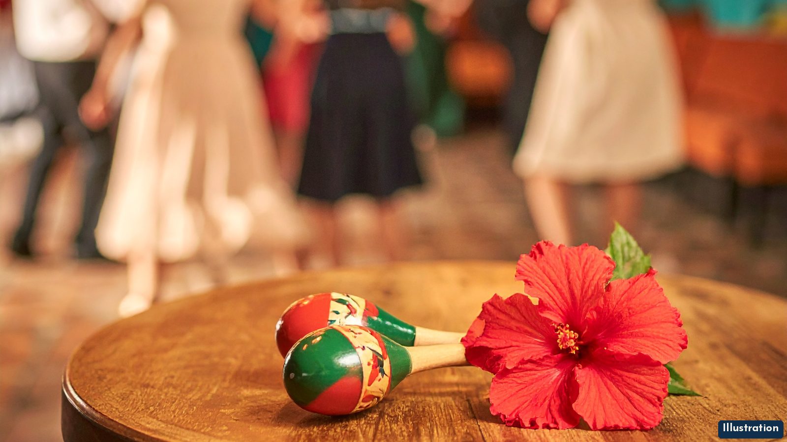 Illustration of two painted maracas and a red hibiscus flower on a small wooden café table, with couples dancing in soft focus under string lights in a turquoise-walled dance hall.